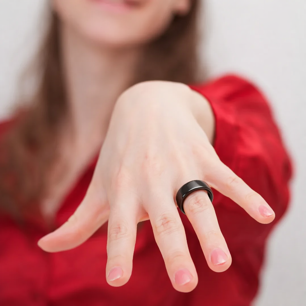 Woman showcasing a Smart Ring on her finger, highlighting its stylish and functional design.
